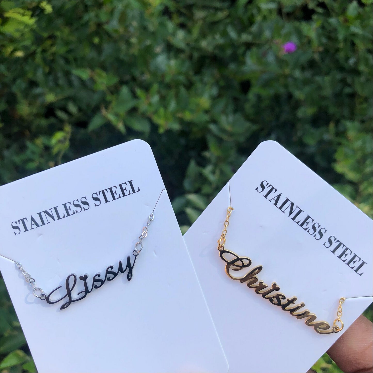 Custom name necklace in two color options: silver and gold, showcasing a polished stainless steel finish.