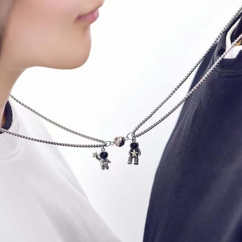 A couple wearing round shaped Astronaut Couple BFF Necklace