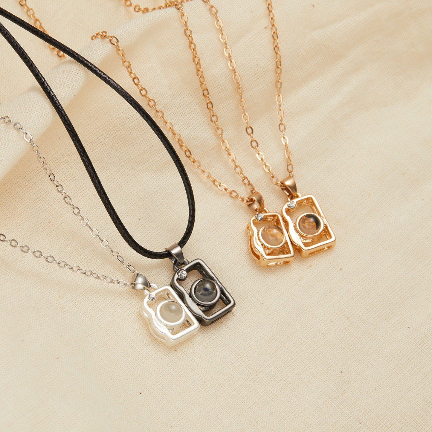 I Love You in 100 Languages BFF Camera Necklace - Both variants - On the table view