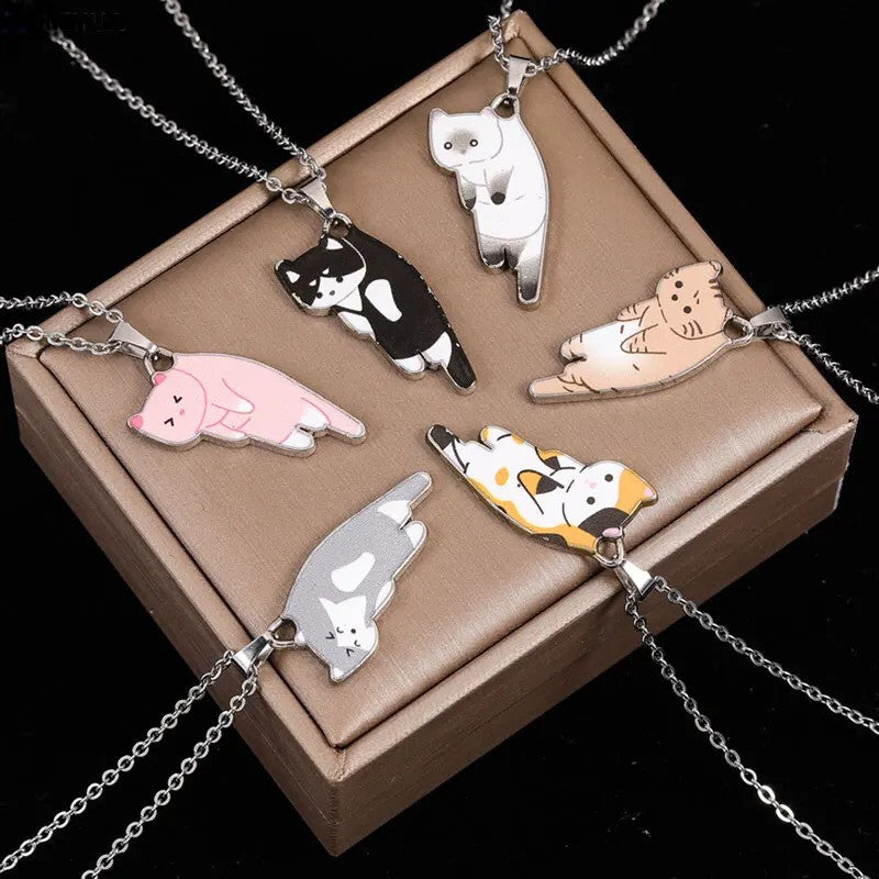 Cat Solo Necklace featuring adorable cat-shaped pendants in different colors including white, black, orange, gray, and pink, attached to delicate silver chains - top of a box view