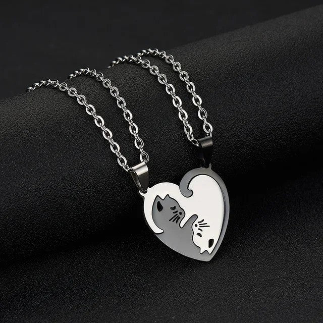 Cuddling Kittens BFF Friendship Necklace - Heart shaped Black color - On the table view