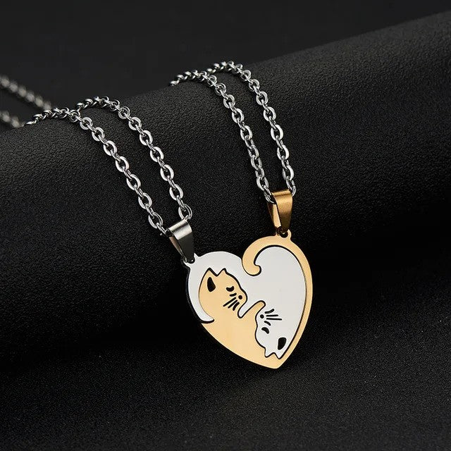 Cuddling Kittens BFF Friendship Necklace - Heart shaped Gold color - on the table view