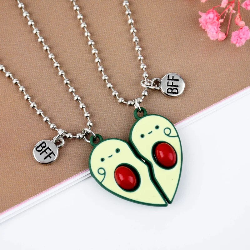 Avocado BFF Friendship Necklace with heart shaped matching pendants -on the table view