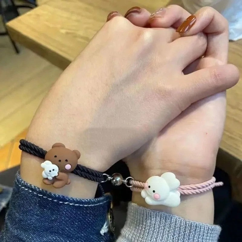 couple holding hands while wearing bunny bear bff friendship bracelet