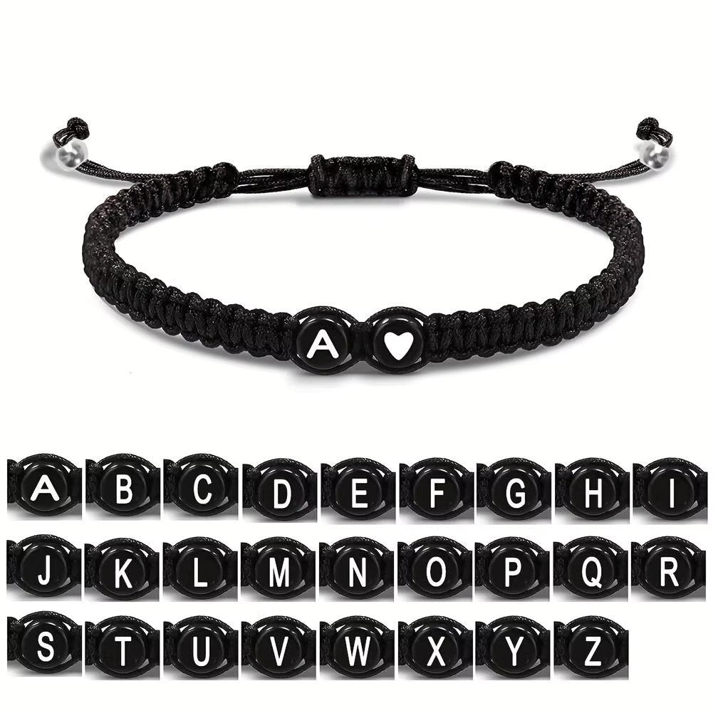 Initial Heart Couple String Bracelet: Black adjustable string bracelet featuring personalized initial and heart beads, perfect for couples or best friends.