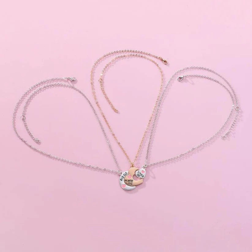 A 3-piece sister necklace set featuring interlocking heart-shaped pendants labeled "Big Sis," "Middle Sis," and "Little Sis" with silver and gold chains. - full view along with chains