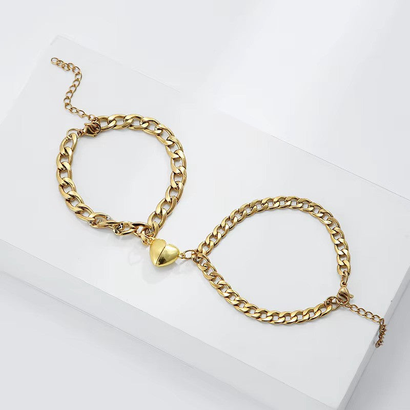 Steel Bond Heart Couple Bracelet – Magnetic steel bracelets with a bonded heart design, symbolizing love and connection in a sleek, durable style for couples. - Classic design Gold color over the top view