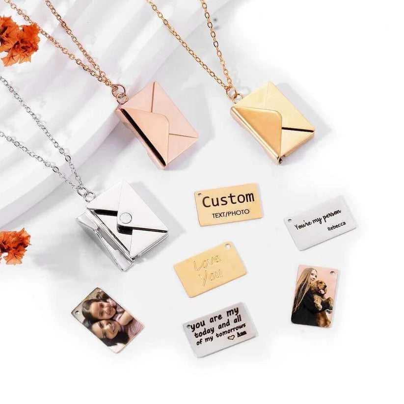 A collection of Custom Engraved Love Letter Necklaces in gold, rose gold, and silver, displayed with engraved message plates and photo pendants.